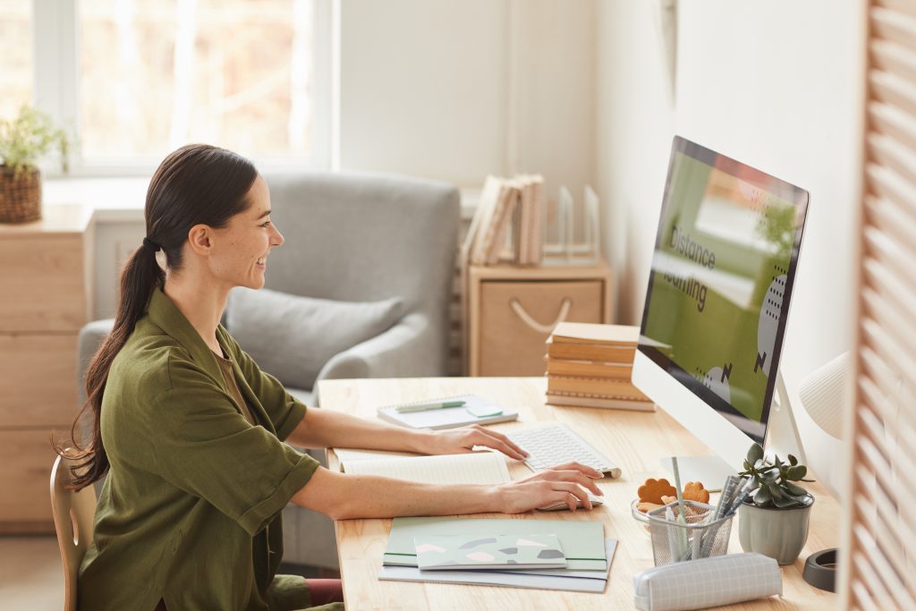 smiling woman enjoying online education 2021 09 24 04 16 20 utc scaled